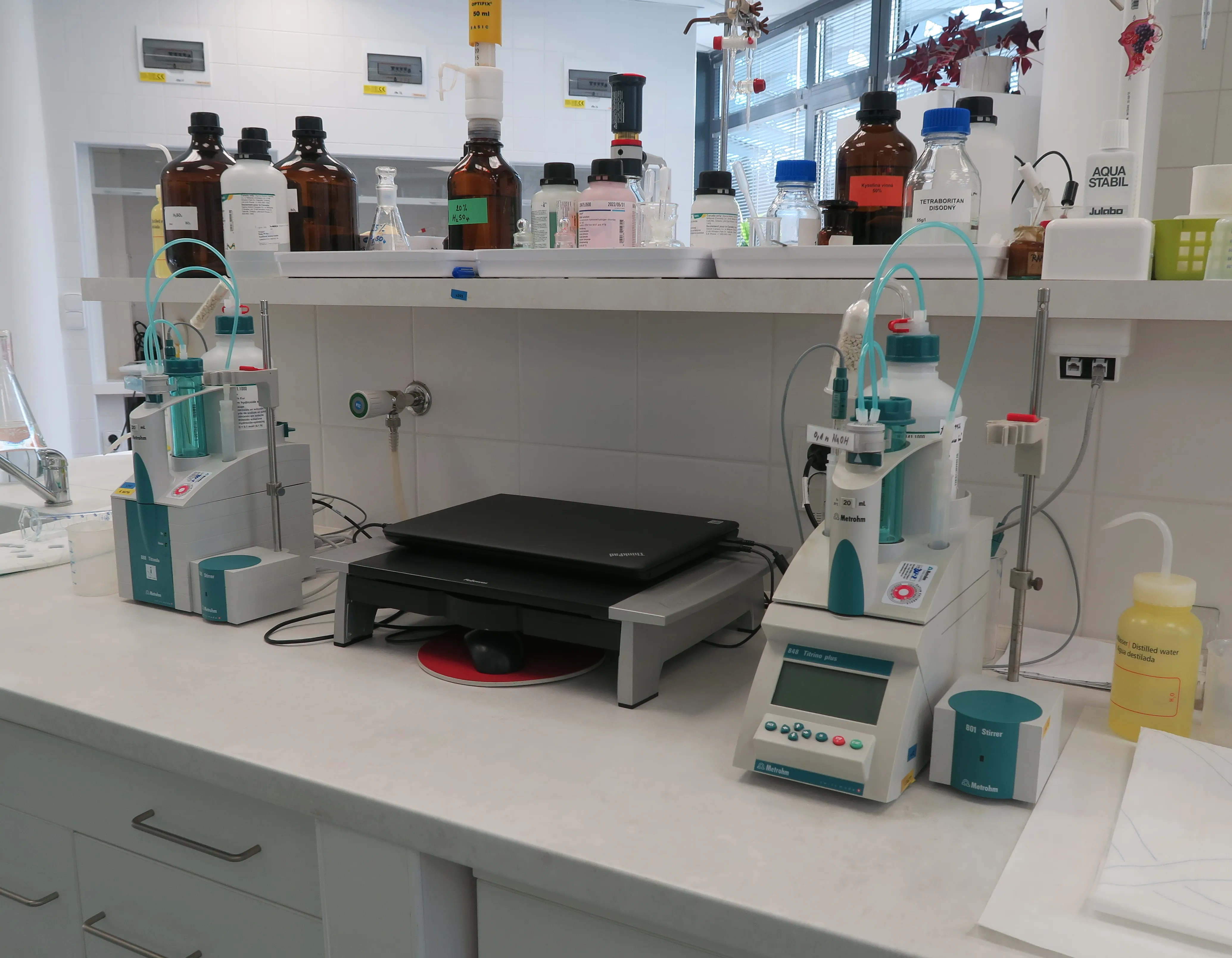 Bank of automatic titrators for content determination